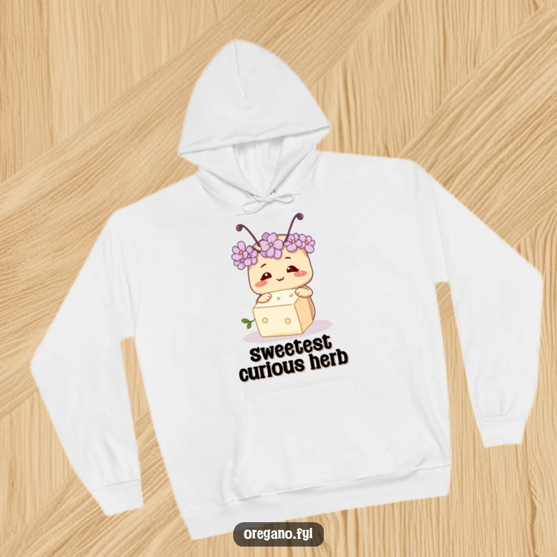 Funny hoodie featuring a smiling oregano herb with tiny antennae, curiously inspecting a small sugar cube, embodying playful curiosity.